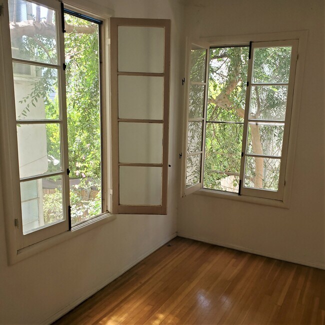 french windows in bedroom - 1235 N Sweetzer Ave