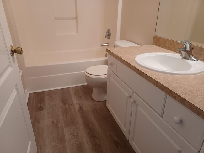 Building Photo - 3/2 with laminate flooring throughout