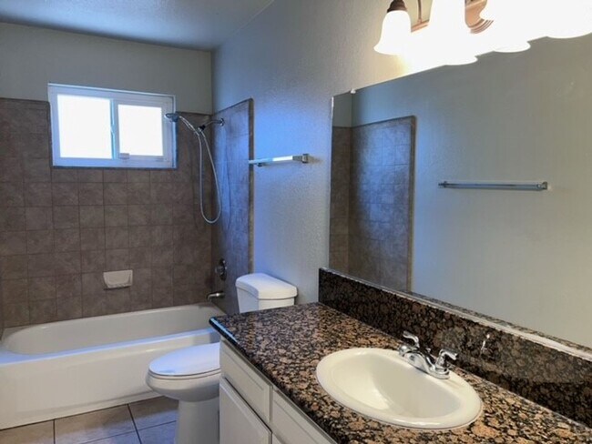 Building Photo - Laminate flooring throughout. Solar panels...