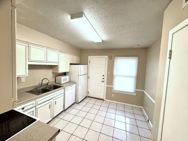 Building Photo - Single-level living on ground floor  |  Fresh paint (July 2026)  |  2 carports  |  Community Pool...
