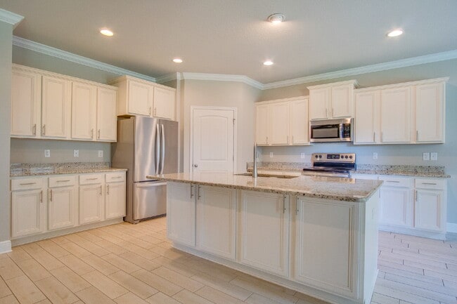 Building Photo - Spacious 4BR Pool Home with Modern Upgrade...