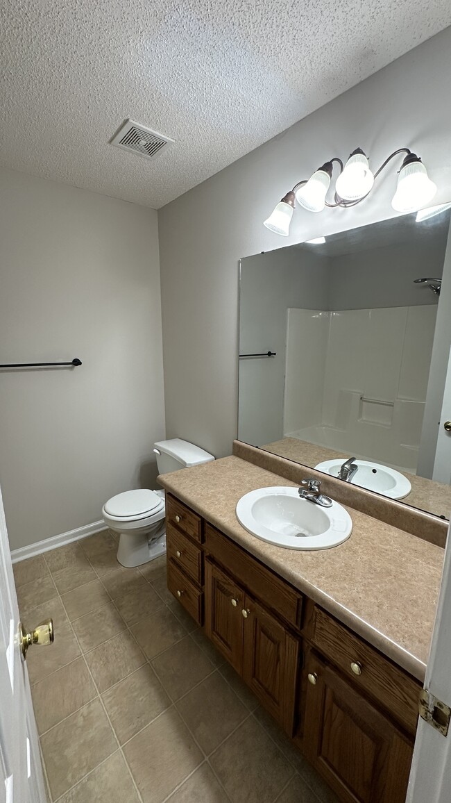 Upstairs bathroom is located between both bedrooms. - 1211 Goldridge Dr SW