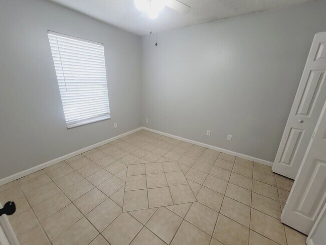 Building Photo - LOVELY 3/2 w/ Screened Porch, New Carpet in Bedrooms, Washer/Dryer, & Privacy Fenced Yard! Includ...