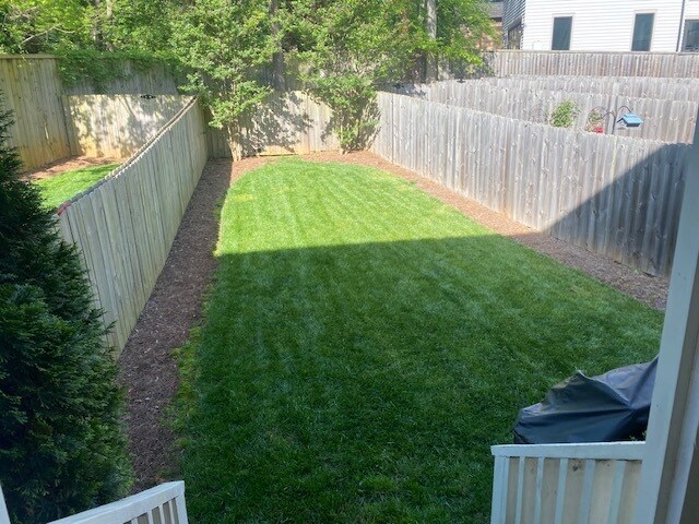 fenced in yard - 2556 Vail Ave