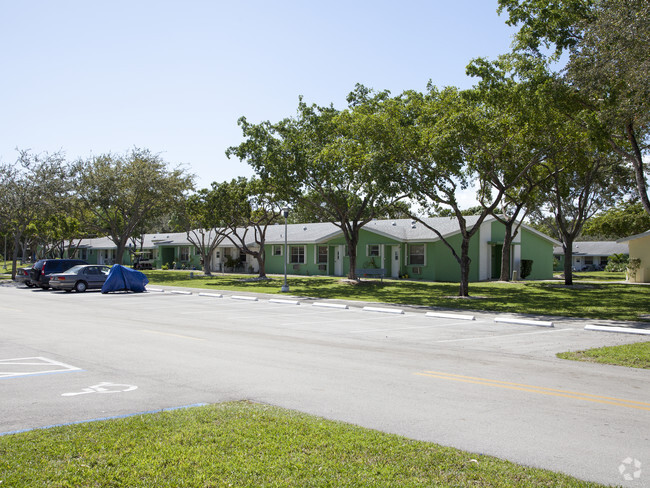 Building Photo - Pine Woods Villa Apartments