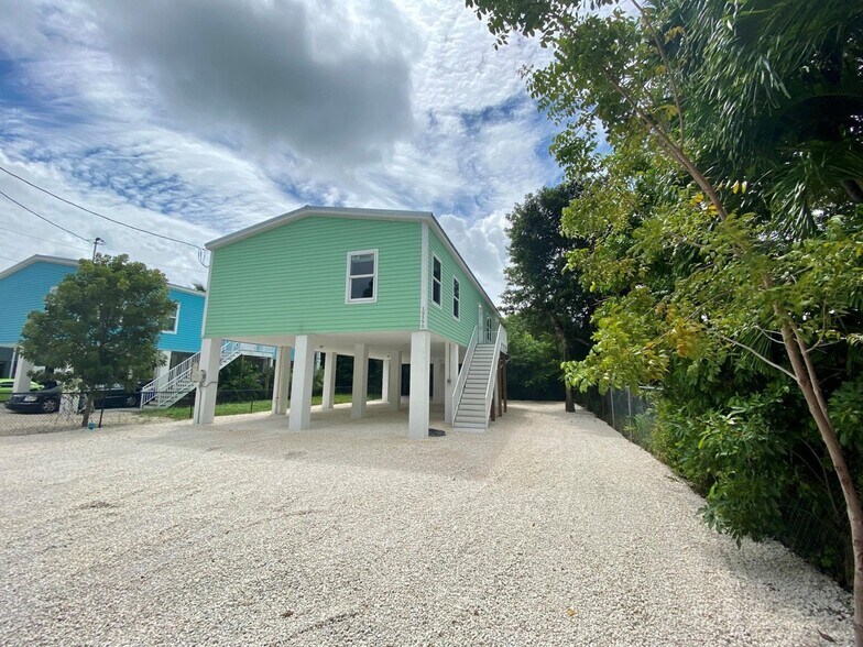 Front with covered parking - 19590 Tequesta St
