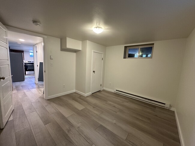 Bedroom 1: 10'4" x 11'5" bedroom off kitchen hallway - 1137 E Platte Ave