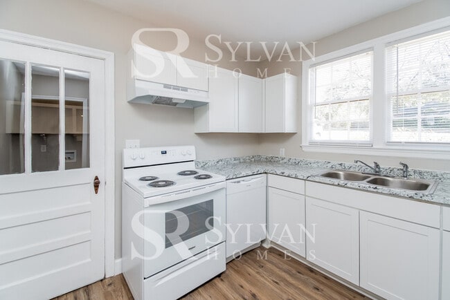 Building Photo - The living is easy in this 3 bedroom, 2 bathroom brick home