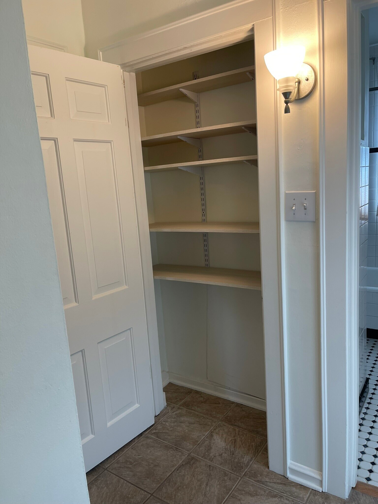 Linen Closet adjacent to the Bathroom. - 2650 S Shore Dr