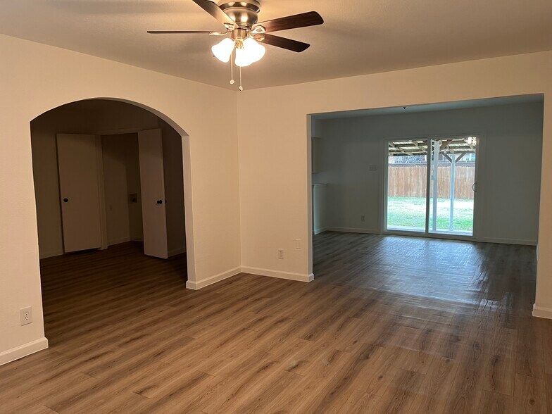 View from front door, living room, extra room and dining area - 9216 Freeport Dr