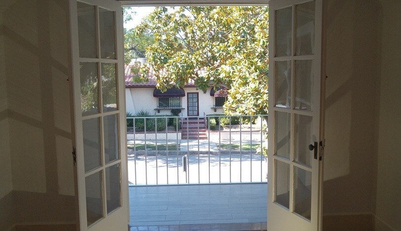 Upstairs porch entered through French doors. - 1135 Magnolia St