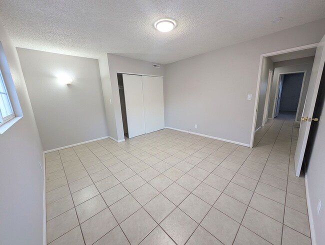 Building Photo - 4-bedroom house with a 2-car garage availa...