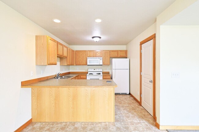 Building Photo - Refined Townhome with Gorgeous Landscaping...