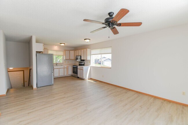 Building Photo - Updated 3BR Split-Level Home with Huge Deck, Fenced Yard & 2-Car Garage Near I-29!