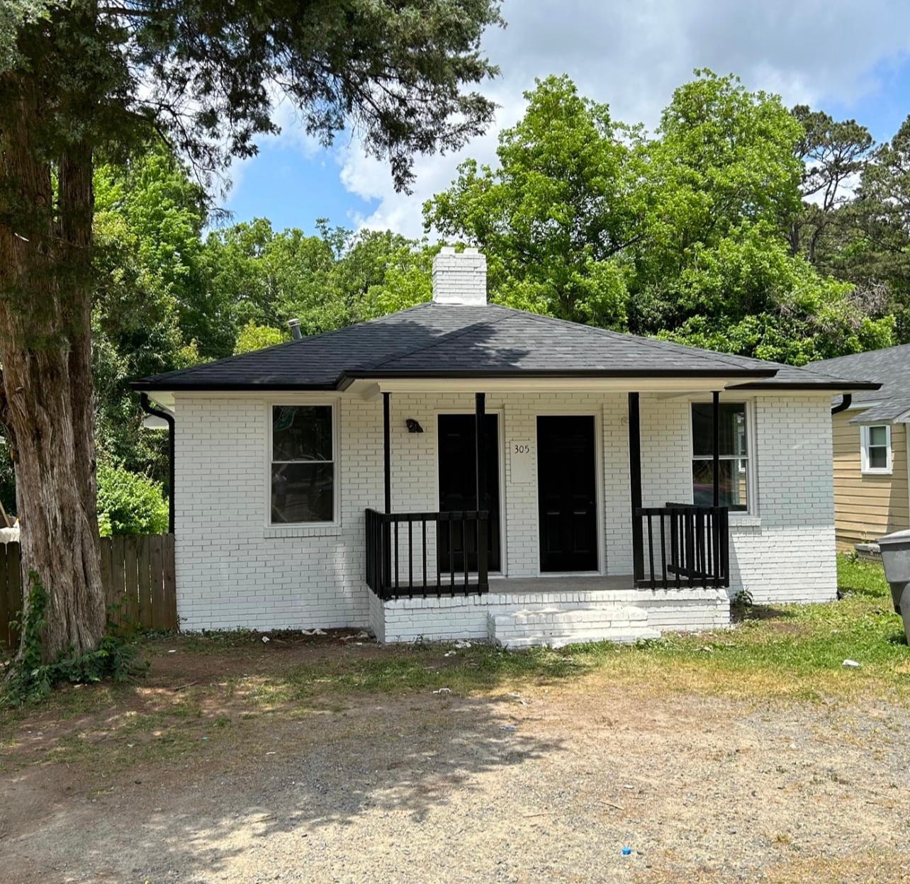 Both doors have access to the house. Right side to living room and left is a bedroom or living space - 305 Orange St