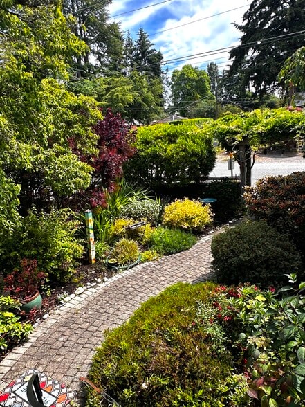 Step outside to peaceful gardens and winding brick pathways - 11639 1st Ave NW