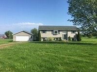 Building Photo - Beautiful secluded 4 bedroom 2.5 bath home with 2 stall detached garage and descent sized yard