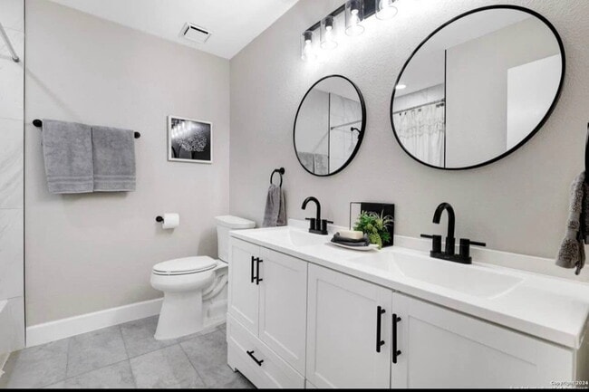 Building Photo - "Charming 4-Bedroom Home with Elegant Gran...