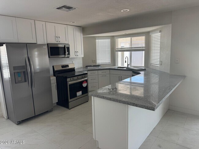Building Photo - 8837 W Highland Ave