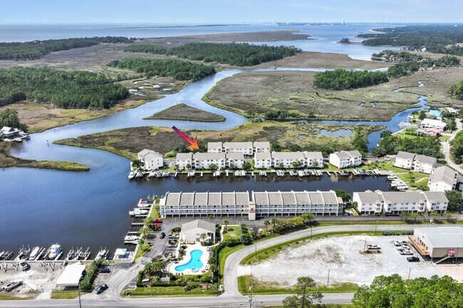 Building Photo - WATERFRONT LIVING! BEAUTIFULLY APPOINTED CONDO ON THE BAYOU IN OS SCHOOL DIST - FULLY FURNISHED
