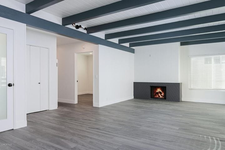 Comfortable family room with fireplace and sliding door to balcony - 133 Anacapa Ave