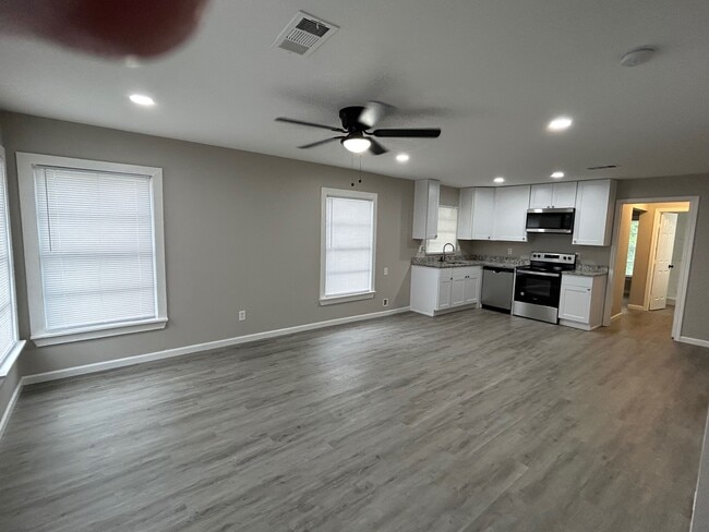 A beautiful open concept Living Room and Kitchen. - 2245 E Overton Rd