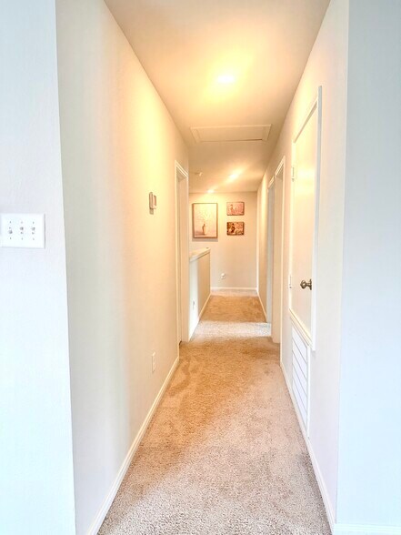 Hallways upstairs. Picture taken from loft - 11040 Pelican Hill Ln