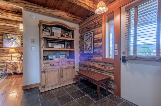 Building Photo - Charming Log Cabin and Carriage House – Do...