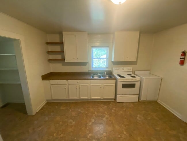 Building Photo - Big kitchen. Fenced yard. Walltown location. Under $1,300.