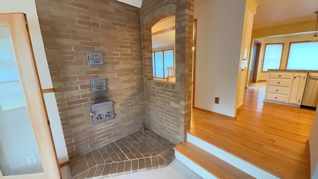 Building Photo - 4bd/3ba HUGE Home w/Hardwood Floors, Russian Fireplace, 2-Car Garage & Fenced Back Yard!