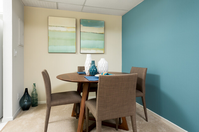 Classic dining room with carpet - eaves Warner Center