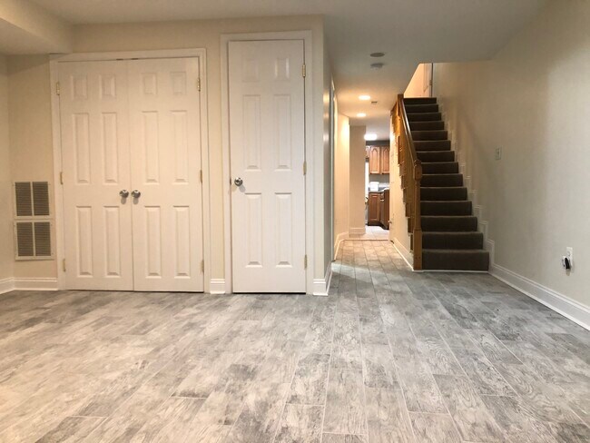 Basement living area + hallway to kitchen - 1204 Florida Ave NE