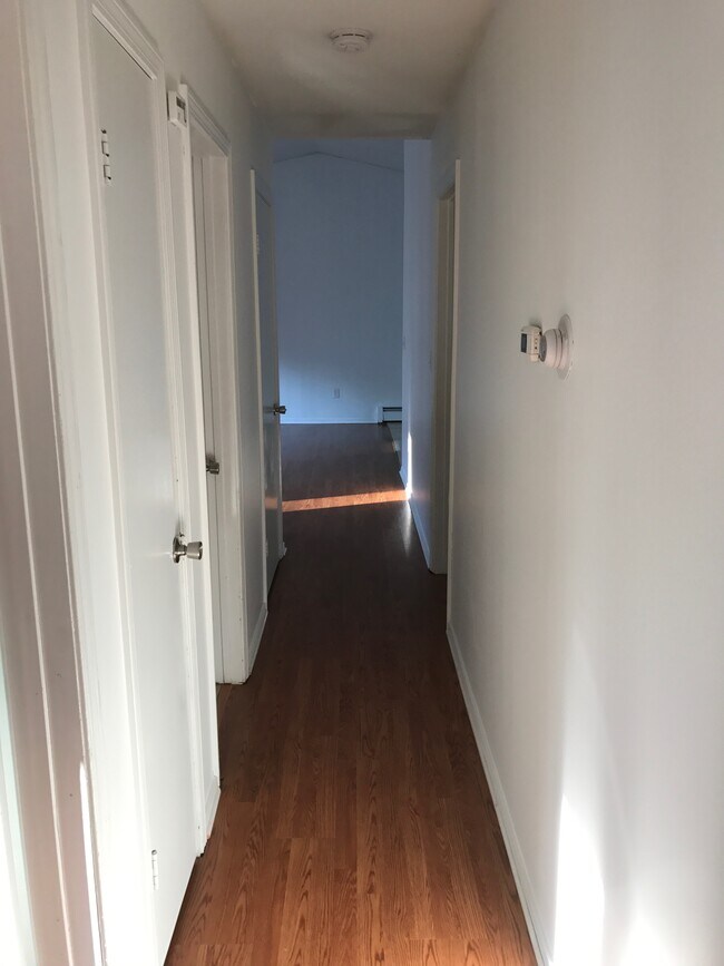 View from the end of the hallway looking towards the living room - 85 Wilson Ave