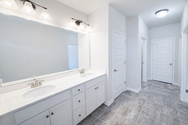 Building Photo - 3-bedroom Townhome in Buford City Schools with Quartz Kitchen, Private Suite, and Walkable Downto...