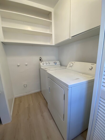 Full-sized washer and dryer in mud room with storage - 1976 Missouri St