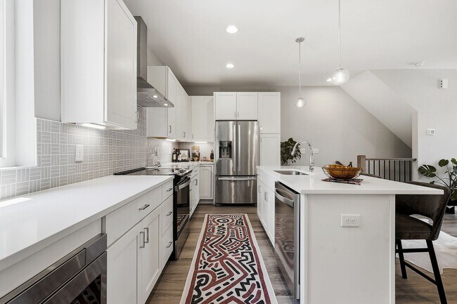 Building Photo - Live Elevated in Downtown Raleigh – Stunning Townhome with Rooftop Oasis!