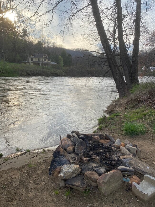 Riverside access and a firepit. - Campus Apartments East
