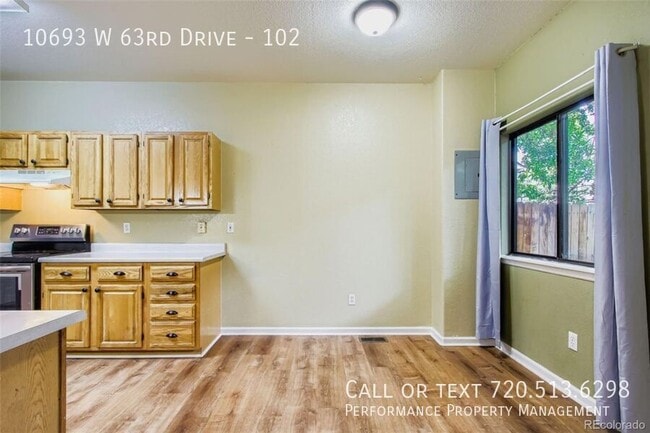 Building Photo - 10693 W 63rd Dr