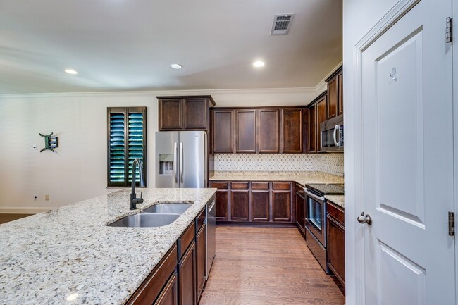 Building Photo - Welcome to this charming end unit townhome