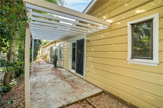 Building Photo - Tucked away behind gorgeous grand gates is this beautifully updated 3 bedroom 2 bath home