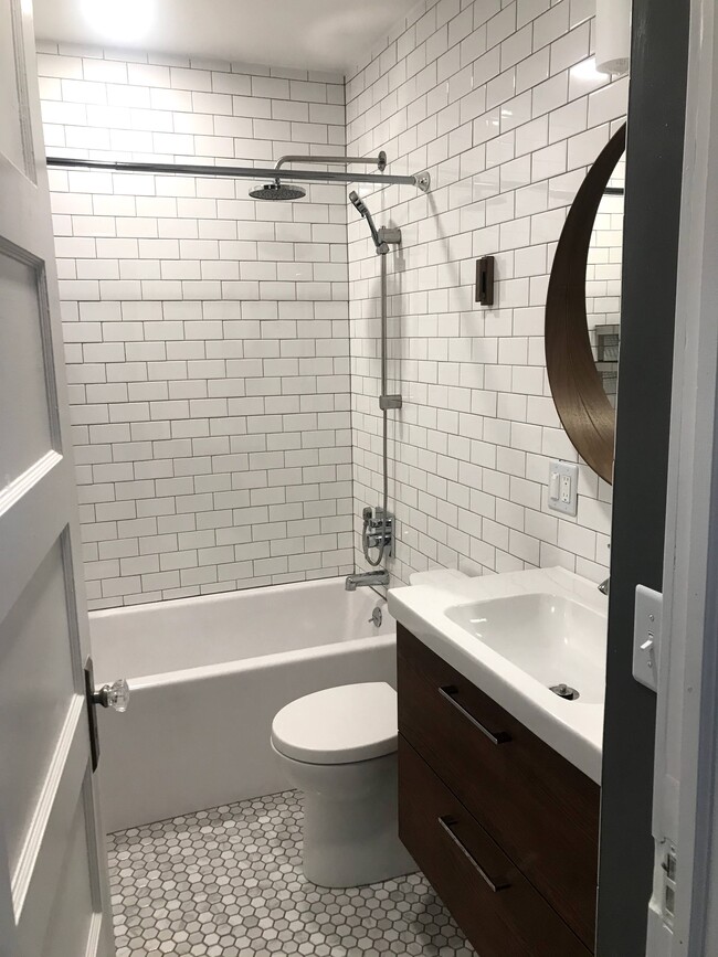 Floating vanity and a bunch of subway tile. - 1233 Jenifer St