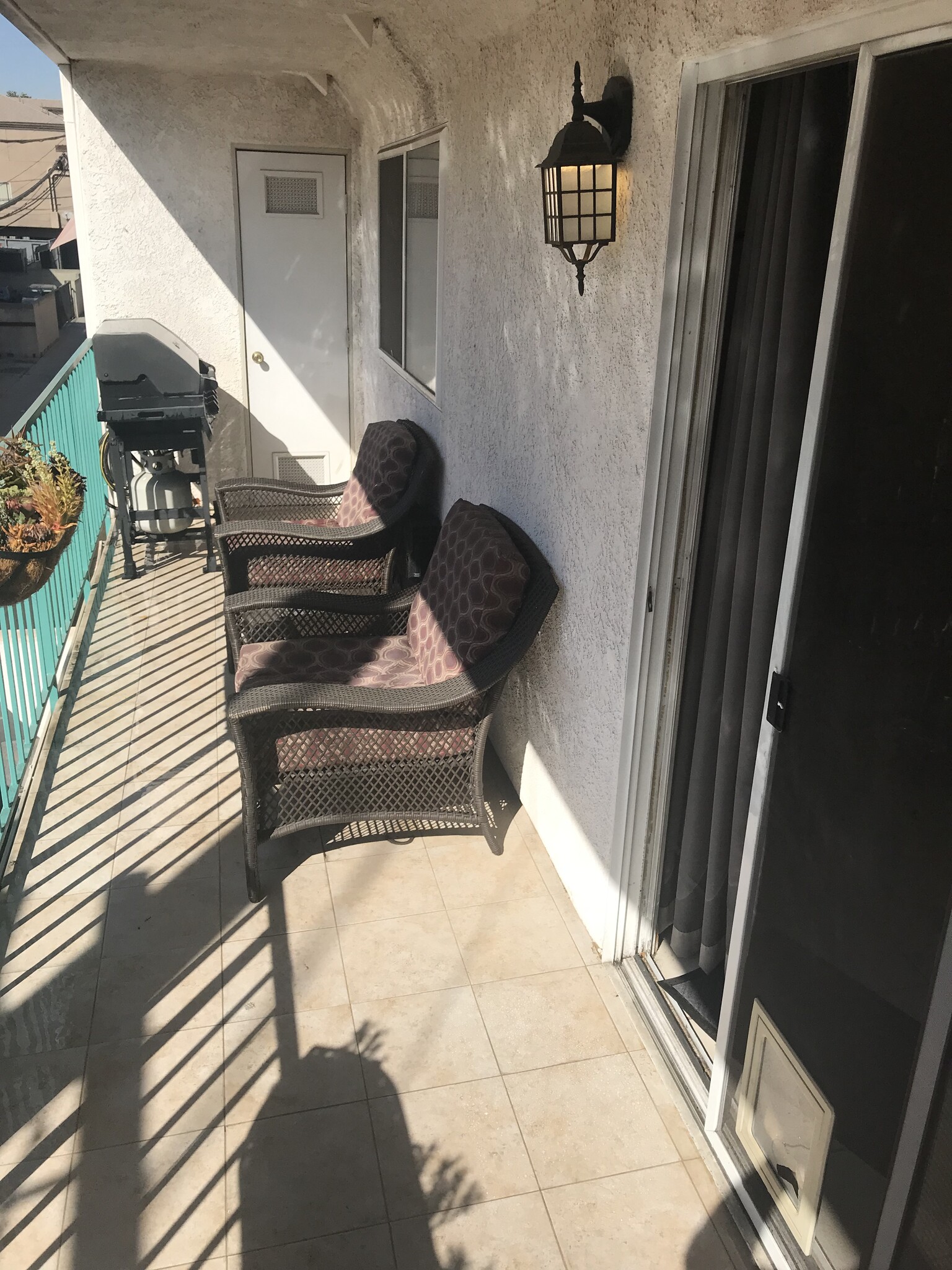 The patio is tiled for easy cleaning - 1335 Newport Ave