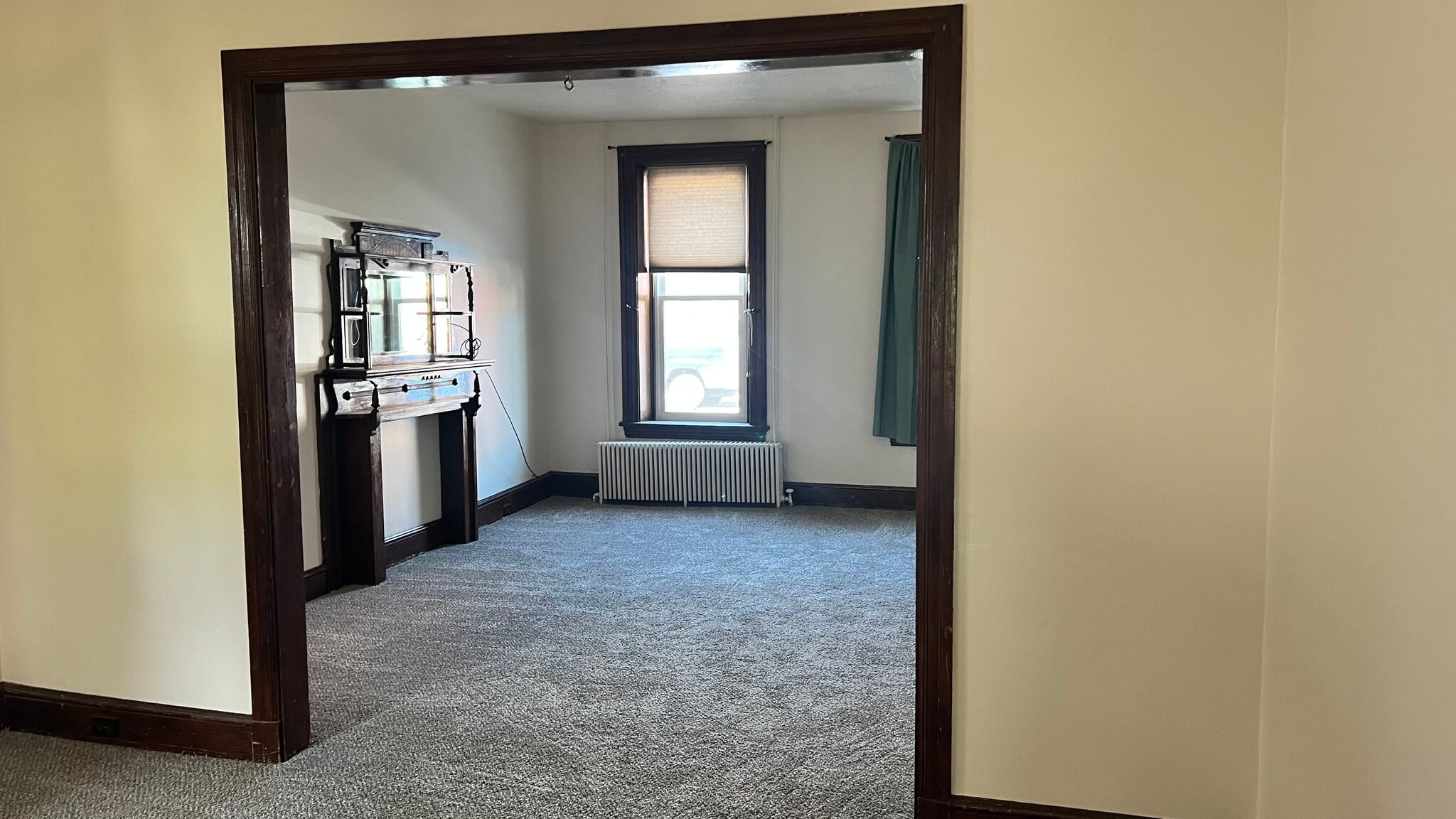 Looking at front room with former fireplace. This looks great with an electric fireplace sitting in - 560 Walnut St