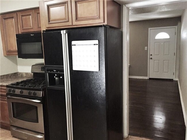 Building Photo - Remodeled 1 story home in Hurst with original plank wood flooring