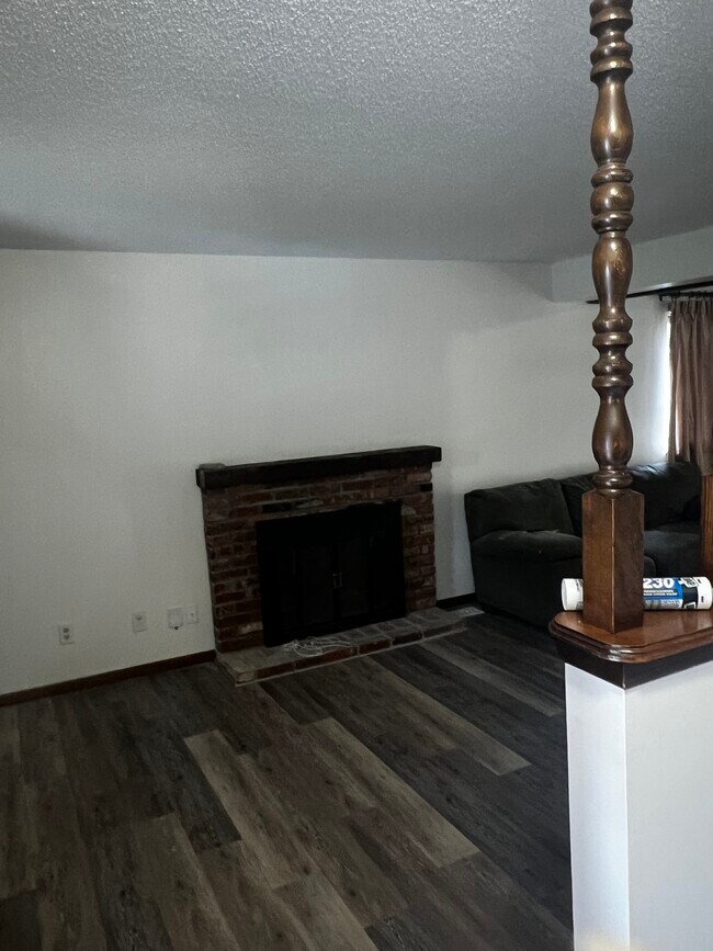 Main level entering front door living room with fireplace. - 5341 SW 15th Ct