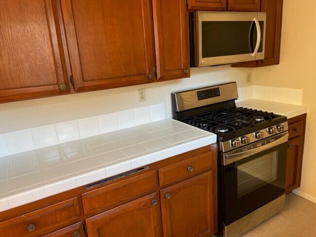 Building Photo - "Coming Soon" Awesome corner 2 Bedroom 2 Bath Townhome with large private patio (AC/Pool/Gated Pa...