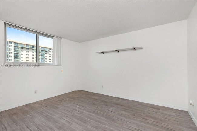 Building Photo - 19380 Collins Ave