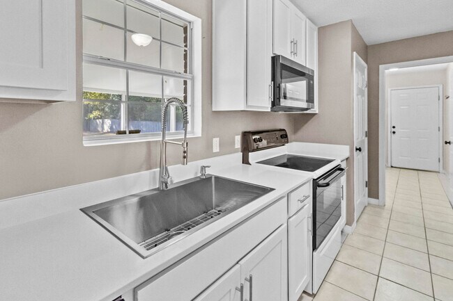 Building Photo - 8103 Menorca St