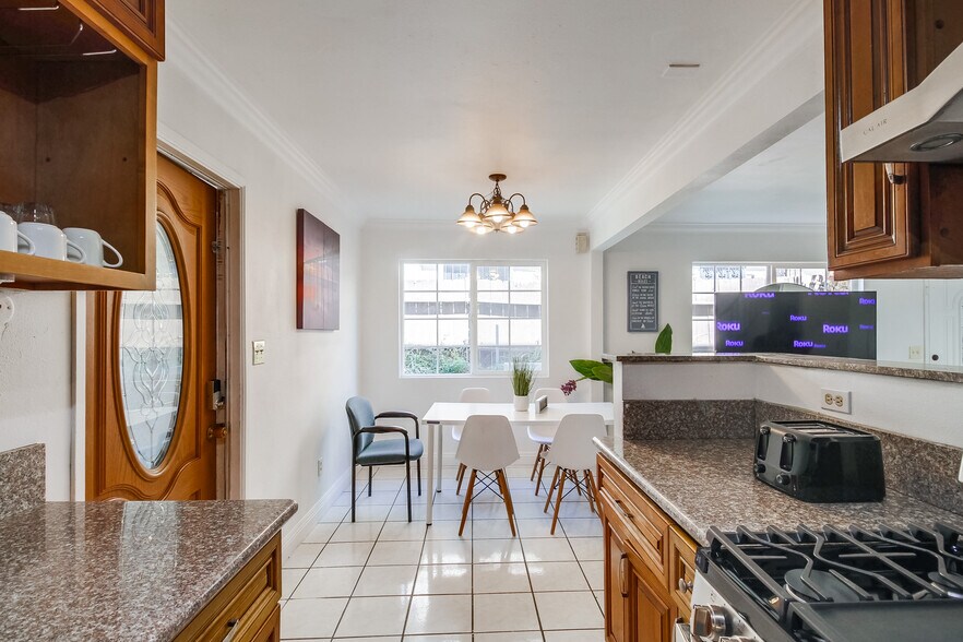 You'll love sharing meals or conversations in our dining space, bathed in natural light. - 2304 E 14th St