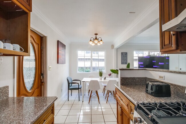 You'll love sharing meals or conversations in our dining space, bathed in natural light. - 2304 E 14th St